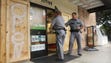 Police enter one of the few remaining businesses open