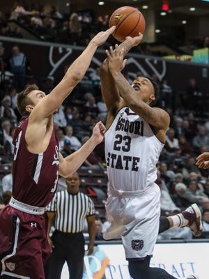 The Missouri State Bears Dorrian Williams gets stopped at the basket while facing off with Southern Illinois Salukis Sunday, January 24, 2016.