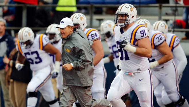 LSU head coach Les Miles leads his team out on the field for the second half of an NCAA college football game against Mississippi in Oxford, Miss., Saturday, Nov. 21, 2015. No. 25 Mississippi won, 38-17. (AP Photo/Rogelio V. Solis)