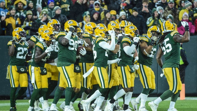Nov 10, 2019; Green Bay, WI, USA;  The Green Bay Packers defense celebrates after recovering a fumble in the second quarter during the game against the Carolina Panthers at Lambeau Field. Mandatory Credit: Benny Sieu-USA TODAY Sports