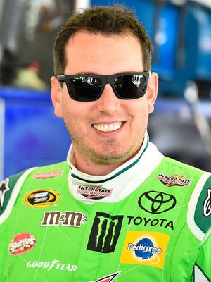 NASCAR driver Kyle Busch wants infield grass at race tracks eliminated.