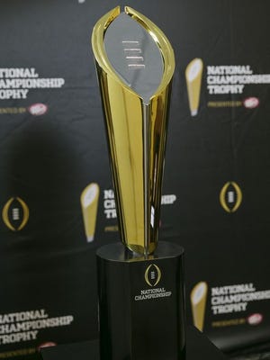 The College Football Playoff trophy will go to the winner of a four-team tournament held Jan. 1 and 12, 2015.