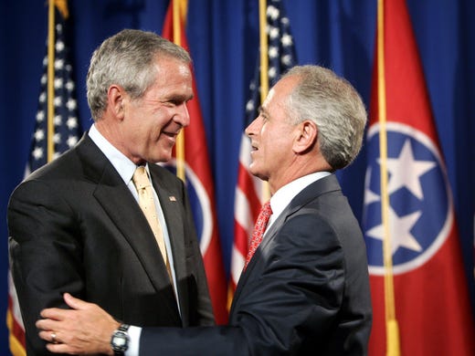 Aug. 30, 2006: President George W. Bush, left, greets