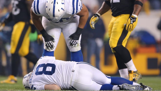 Indianapolis Colts guard Lance Louis (60) hovers over quarterback Matt Hasselbeck (8) after he suffered an injury during the second half of an NFL football game Sunday, Dec. 6, 2015, at Heinz Field, in Pittsburg, Pa.