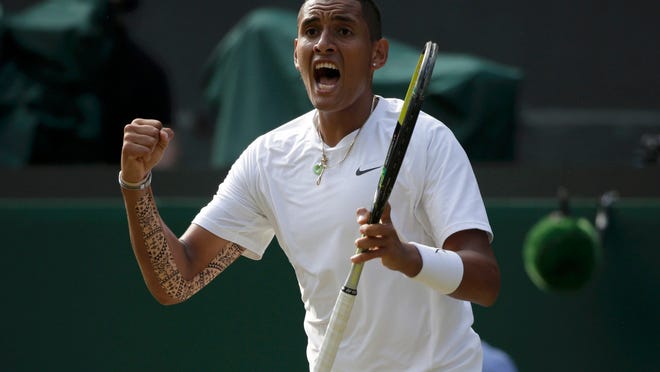 
Nick Kyrgios reacts during his match against Rafael Nadal at Wimbledon on Tuesday. Kyrgios beat Nadal, 7-6 (5), 5-7, 7-6 (5), 6-3, to reach the quarterfinals.
