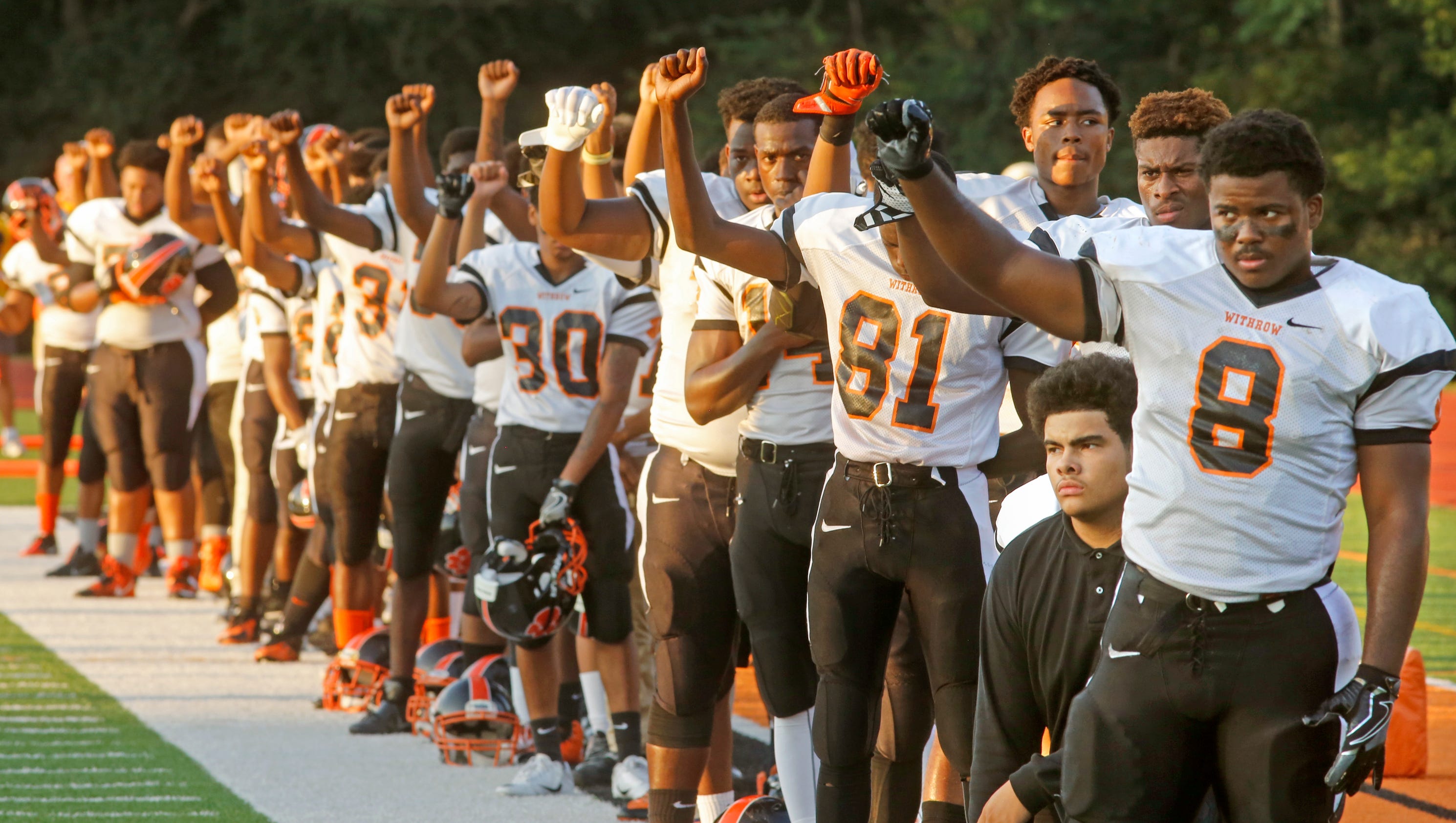 Withrow football team's national anthem protest grows