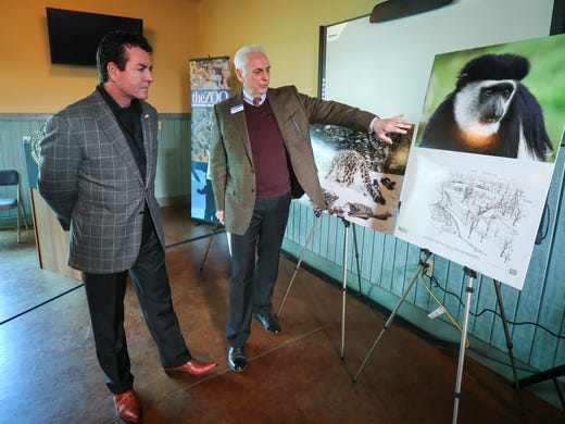 John Schnatter looks over renderings of a new exhibit