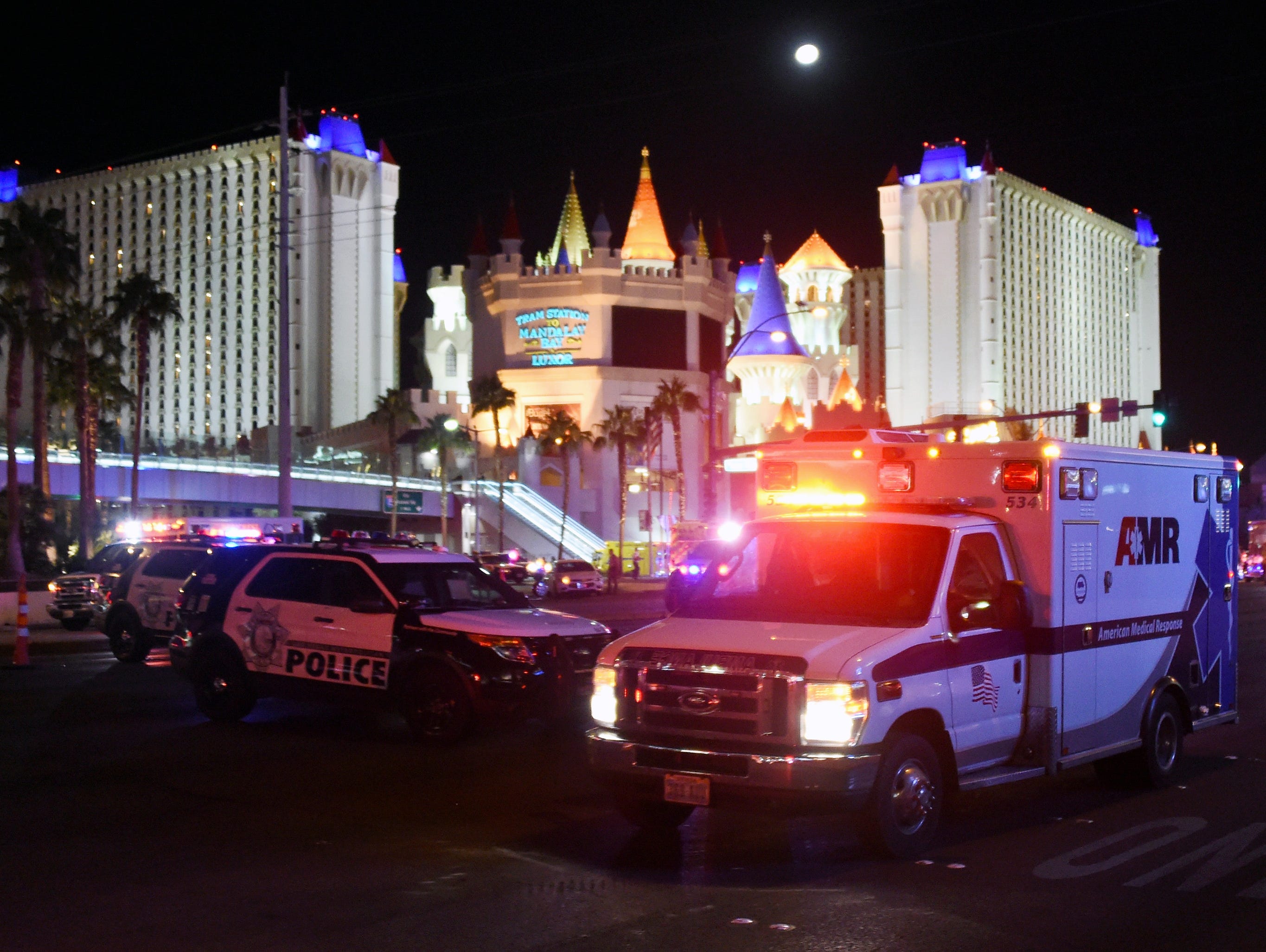 An ambulance leaves the intersection of Las Vegas Blvd. and Tropicana Ave. after a mass shooting at a country music festival nearby on Oct. 2, 2017 in Las Vegas.