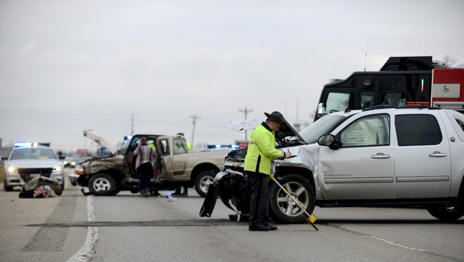 Ohio Highway Patrol troopers investigate a crash Thursday, Dec. 7, 2017, at Columbus-Lancaster Road and Election House Road in Lancaster. OHP Lt. Shad Caplinger said that while the crash was still under investigation it appeared the driver of a tan Ford Ranger pulled into the east bound lane of Columbus-Lancaster Road from Election House Road and into the path of a silver Chevrolet Avalanche. Both drivers were taken to Grant Medical Center in Columbus. Greenfield Township firefighters at the scene said the drivers of both vehicles were conscious and appeared to have minor non-life threatening injuries.