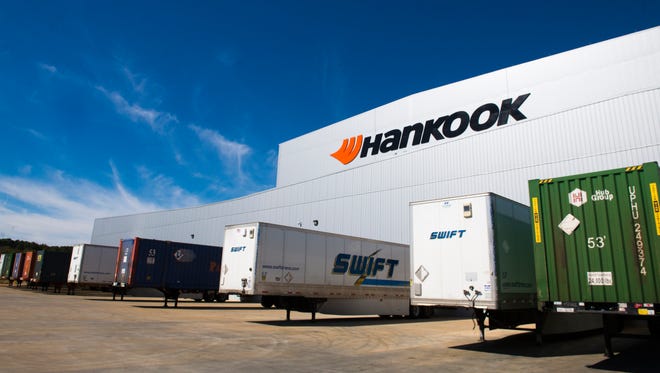 Trucks outside of Hankook's tire inventory building. The building can hold up to a capacity of 350,000 tires.