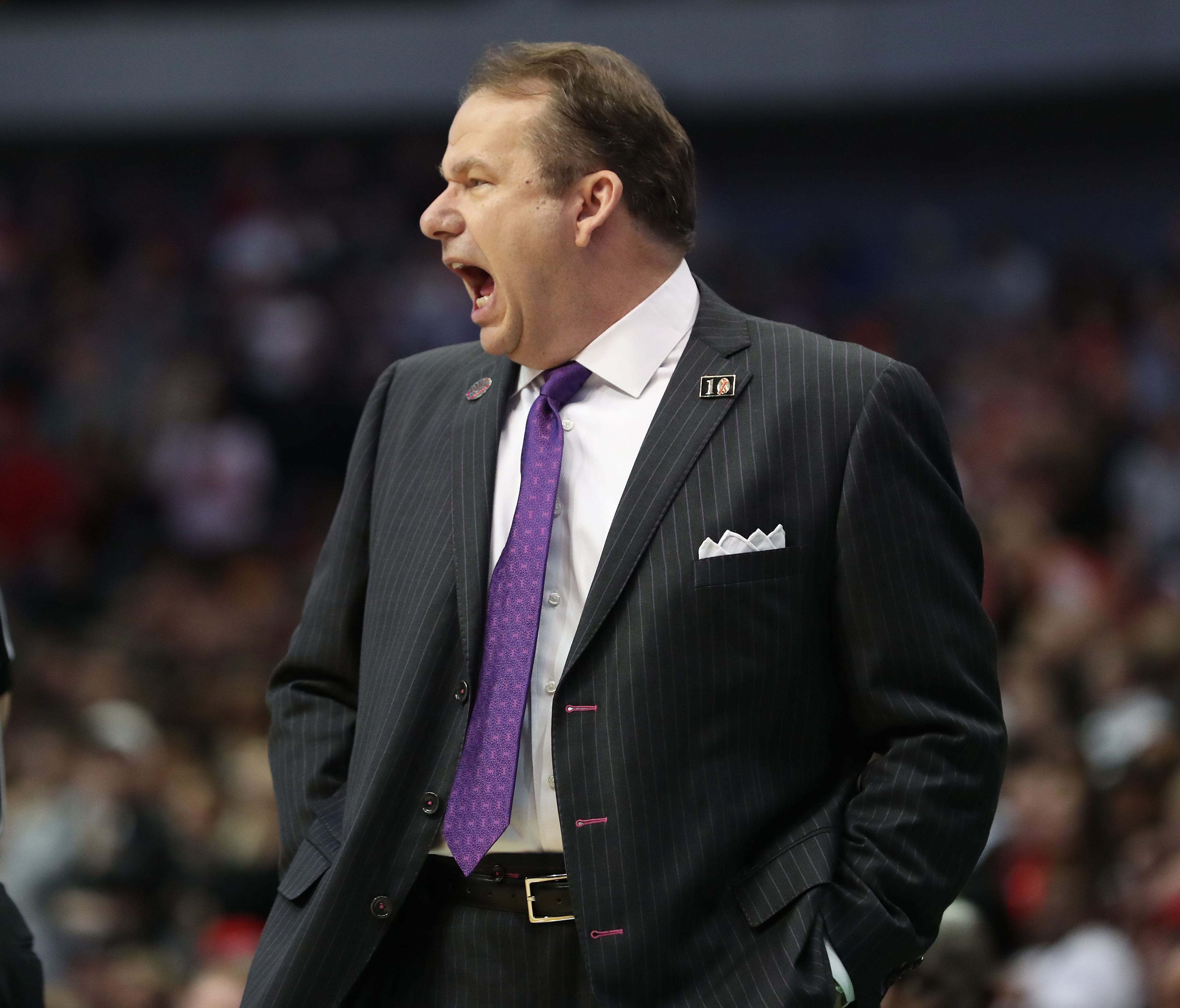Stephen F. Austin Lumberjacks head coach Kyle Keller yells from the sidelines during the game against the Texas Tech Red Raiders in the first round of the NCAA tournament.