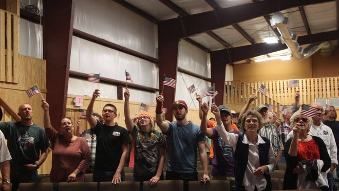 Participants in last year's For God & Country event wave American flags at Broken Chains Freedom Church. This year's event will be May 19-20.
