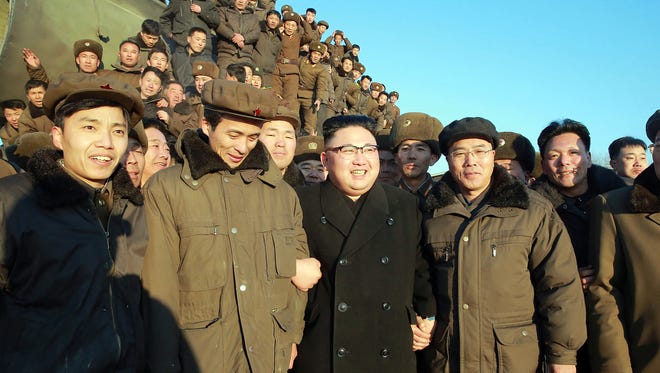 This photo taken on Feb. 12, 2017, by North Korea's official Korean Central News Agency (KCNA) shows North Korean leader Kim Jong-Un surrounded by soldiers of the Korean People's Army as he inspects the test-launch of a surface-to-surface medium long-range ballistic missile Pukguksong-2 at an undisclosed location.
