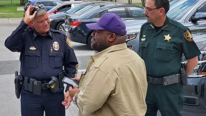 School Board Chairman Eric Cummings, center, stands with Ocala Police Cheif Greg Graham and Sheriff Billy Woods before a Black Lives Matters march on May 31. Cummings wants to provide racial sensitivity and cultural diversity training to the local school district staff.