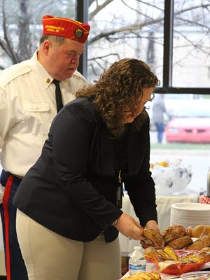 Guests at Wednesday's one-year anniversary celebration for Livingston County's Veterans' Treatment Court get breakfast before the program begins at the Judicial Center.