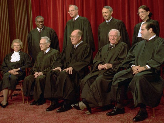 Members of the Supreme Court pose for their portrait