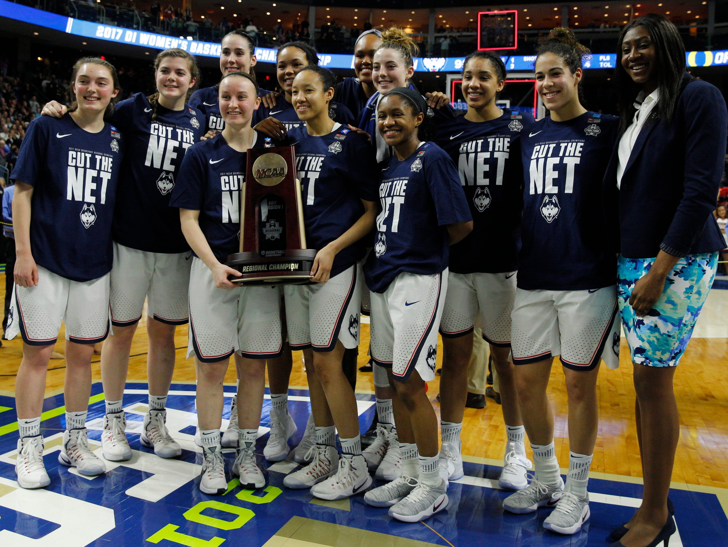 Connecticut players pose for a photo after defeating Oregon in the championship game of the  Bridgeport Regional in the 2017 NCAA women's basketball tournament.
