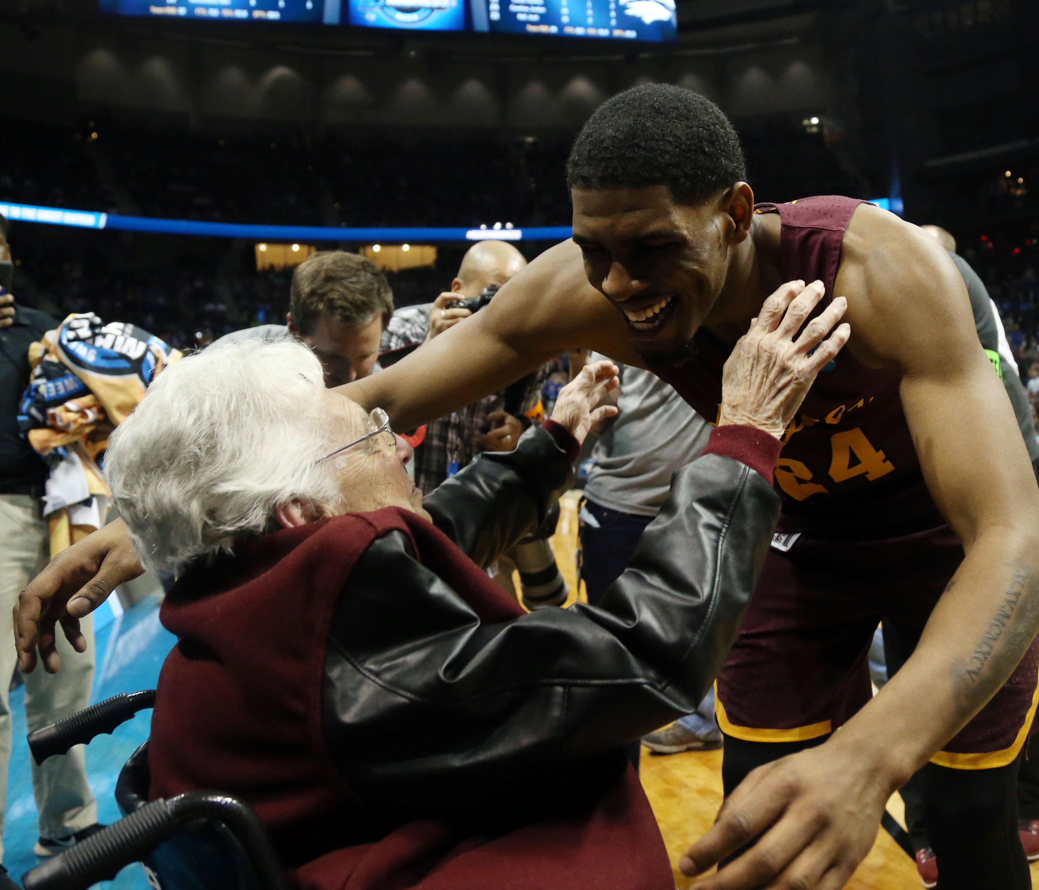 Mar 22, 2018; Atlanta, GA, USA; Loyola Ramblers forward Aundre Jackson (24) hugs Sister Jean Dolores-Schmidt after defeating the Nevada Wolf Pack in the semifinals of the South regional of the 2018 NCAA Tournament at Philips Arena. Mandatory Credit: 