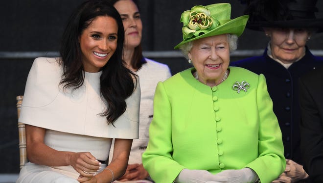 Queen Elizabeth II sits with Meghan, Duchess of Sussex during a ceremony to open the new Mersey Gateway Bridge on June 14, 2018 in the town of Widnes in Halton, Cheshire, England.
