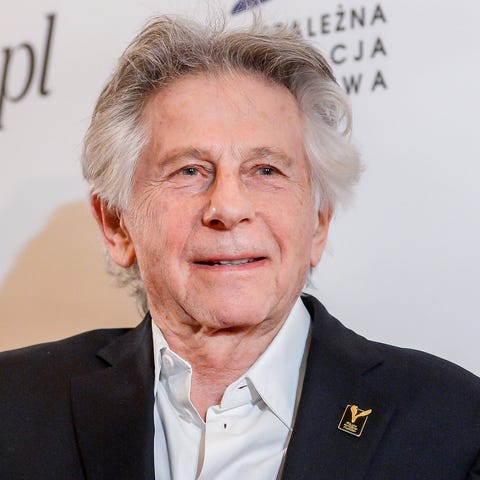 Director Roman Polanski poses with an award he rec