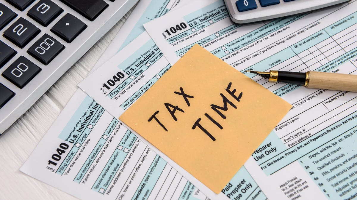 Tax forms and calculators with note that says Tax Time