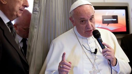 Pope Francis says that people who are provocateurs should expect a reaction. He spoke to the news media during his flight from Sri Lanka to Manila, Philippines, on Thursday, Jan. 15, 2015.