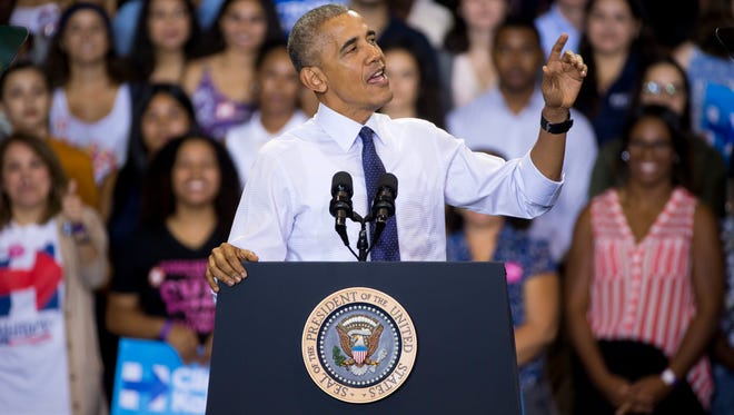 President Barack Obama speaks while campaigning for Democratic presidential nominee Hillary Clinton at Florida International University Thursday, Nov. 3, 2016, in Miami.