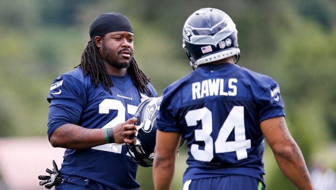 Eddie Lacy, left, and Thomas Rawls enter training camp competing to be the Seahawks' lead running back.