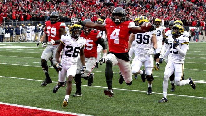 Ohio State's Curtis Samuel jumps for joy as he scores the winning TD in the second overtime to beat Michigan, 30-27, at Ohio Stadium on Saturday, Nov. 26, 2016.