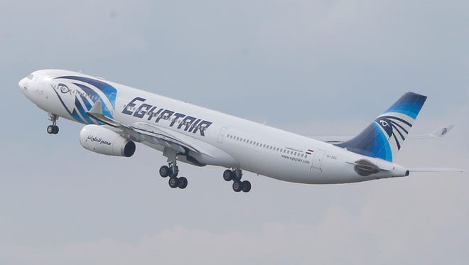 FILE - In this May 19, 2016 file photo, an EgyptAir Airbus A330-300 takes off for Cairo from Charles de Gaulle Airport outside of Paris. Egyptians officials say a bomb threat has forced an EgyptAir airliner en route to Beijing from Cairo to make an emergency landing in Uzbekistan, where the aircraft is being searched. (AP Photo/Christophe Ena, File)