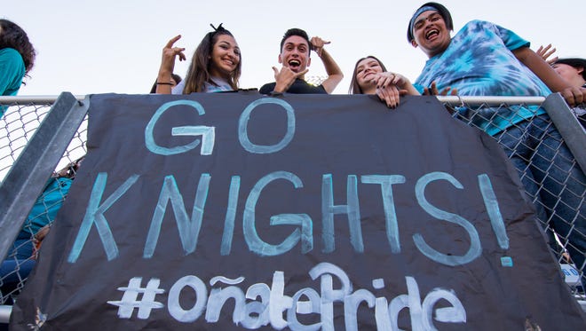 Onate seniors cheer the Knights on during the Onate homecoming game against Atrisco Heritage Academy on September 1, 2017.