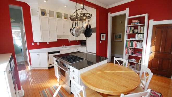 The kitchen features a casual eating area as well as plenty of built-in storage space.