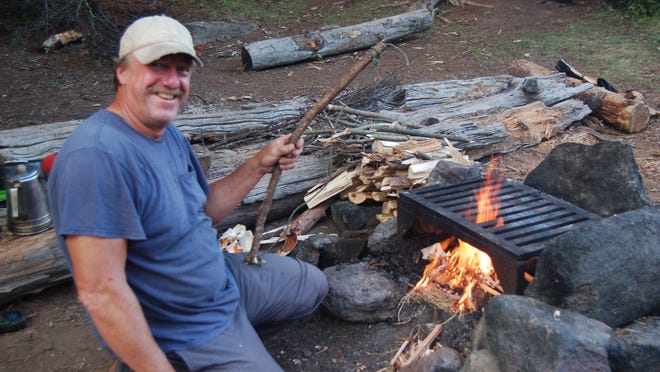 Ramsey Dowgiallo of Westland starts a fire with a bow drill. Dowgiallo, who leads canoe trips in Minnesota, will speak at Outdoorama Thursday-Sunday, Feb. 26-March 1, at Suburban Collection Showplace, Novi.