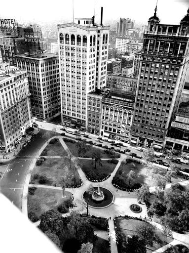 Grand Circus Park in Detroit taken from the David Whitney Building in 1931. Park Avenue curves up on the left side of the image to intersect with Adams Street.