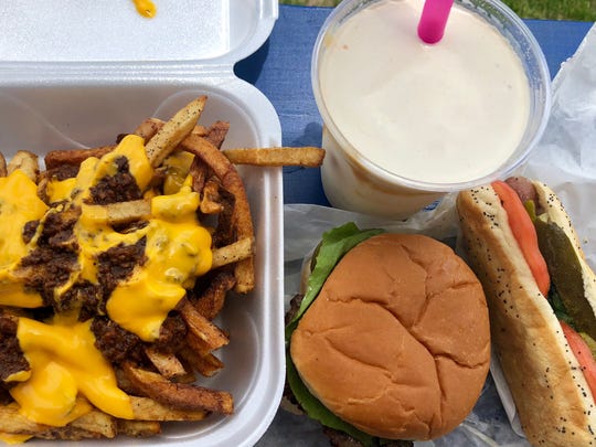 Chili cheese fries, a cheeseburger, Chicago dog and peanut butter milkshake from Lucky Dawgs 2 in Golden Gate.