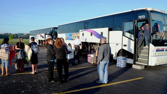 Catholics get ready to depart from charter buses in Fremont to see the Pope in New York and Philadelphia.
