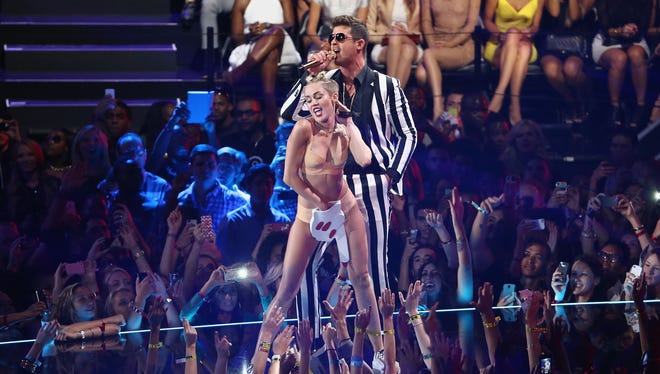 Miley Cyrus and Robin Thicke performs onstage during the 2013 MTV Video Music Awards at the Barclays Center on August 25, 2013 in the Brooklyn borough of New York City.