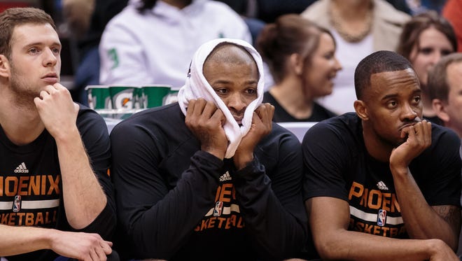 Jan 17, 2016: Phoenix Suns forward P.J. Tucker (17) watches from the bench in the fourth quarter against the Minnesota Timberwolves at Target Center. The Minnesota Timberwolves beat the Phoenix Suns 117-87.