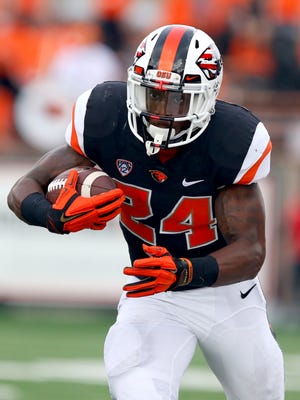 Oregon State running back Storm Barrs-Woods (24) runs after a catch against Weber State during the first half at Reser Stadium, Friday, September 4, 2015, in Corvallis, Ore. The Beavers won the game 26-7.