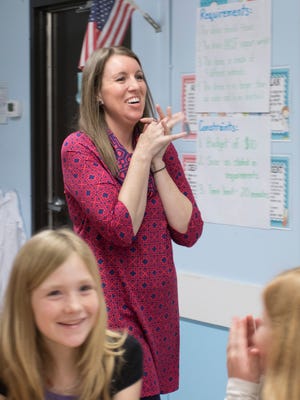 Kristen White reacts as she finds out that she has been selected as the Santa Rosa County School District's Teacher of the Year at East Milton Elementary School in Milton on Friday, January 20, 2017. White is a STEAM (Science, Technology, Engineering, Art & Mathematics) Lab & Reading Intervention teacher.