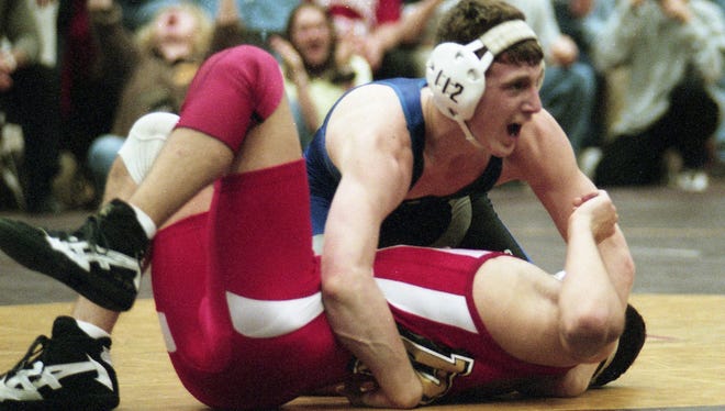 Sterling's Mark Manchio, top, reacts after his pin of Delsea's Joe Alexander at 7 minutes, 41 seconds, in the 112-pound title bout of the Region 8 wrestling tournament on March 7, 1998. The match and rivalry is still regarded as one of the best in South Jersey history.
