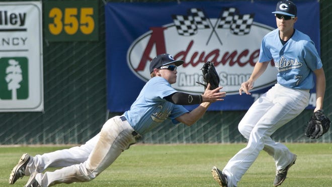 CVC’s Joshua Jones, left, makes a diving catch to out Delano’s Gabriel Ulloa in a Tulare/Visalia Baseball Invitational game on Monday at Mt. Whitney High School.