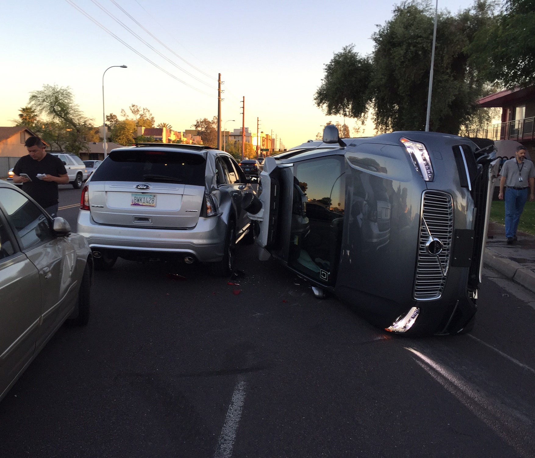 The scene from an accident involving a self-driving Uber car on Friday, March 24, 2017. The car on its side is the Uber vehicle. The Tempe, Ariz., police department released the accident report Wednesday, March 29, 2017. The driver who made the left 