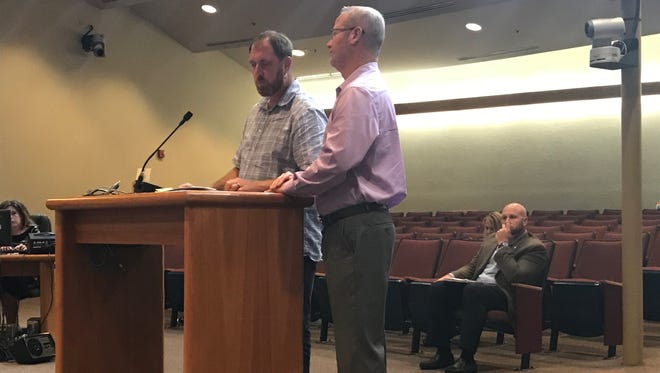 At left, Scott Rayner, co-owner of Coastal Concessions LLC, the management company at the Navarre Beach Pier, prepares to address Santa Rosa County commissioners during a meeting on Monday, April 24, 2017, in Milton. At right is Chris Thomas, who was contracted by Coastal Concessions to run the kitchen at the pier restaurant, Lagerheads on the Gulf. The county did not know about the arrangement until recently but will not hold Coastal Concessions in breach of its contract.