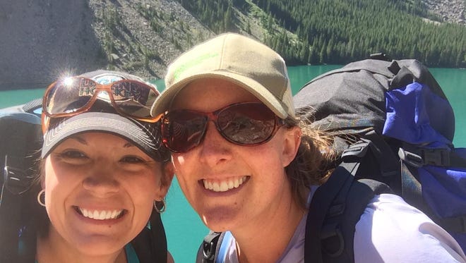 Tribune outdoors writer Erin Madison, right, hikes in the Beartooth Mountains with friend Cassy Guile.