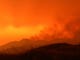 Smoke from the Carr Fire fills the sky at sunset Friday.