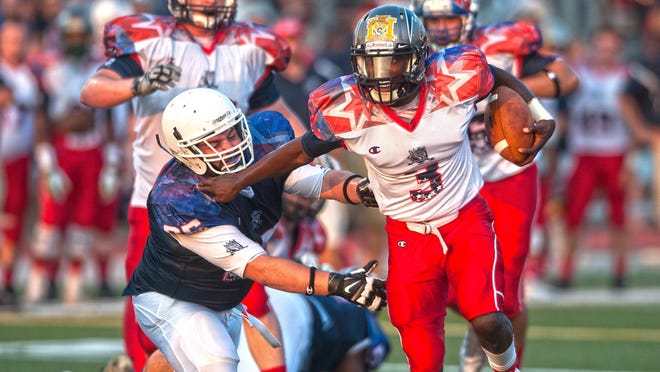White Squad quarterback Khalil Trotman breaks away from Blue Squad Joe Greco during the second quarter of the South Jersey Coaches-Adam Taliaferro All-Star Football Classic.