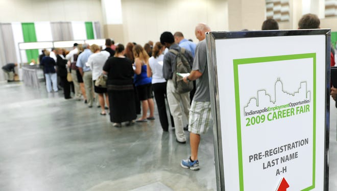 People wait in line to attend the 2009 Indy Career Fair held at Lucas Oil Stadium on June 23, 2009.