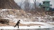 North Korean soldiers stand at their watchtower as