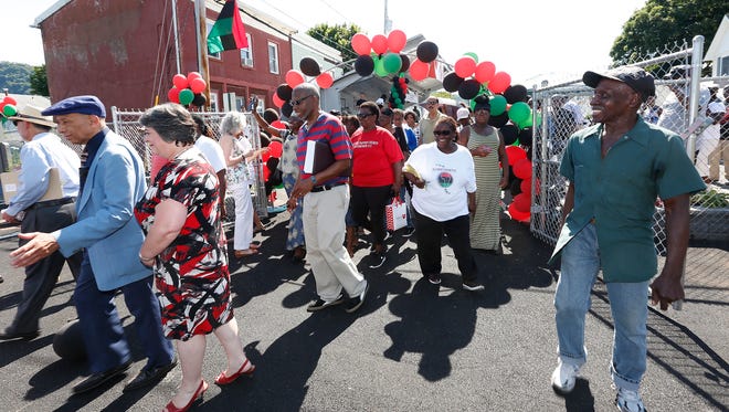 Guests enter the African American Memorial Park during the dedication ceremony in Haverstraw on Saturday, June 18, 2016.  